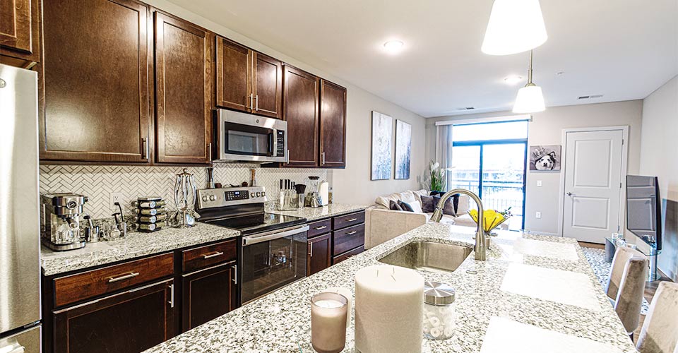 WWP_Staged_Apartment_Kitchen_towards_Living_Room_Amenities_960x500